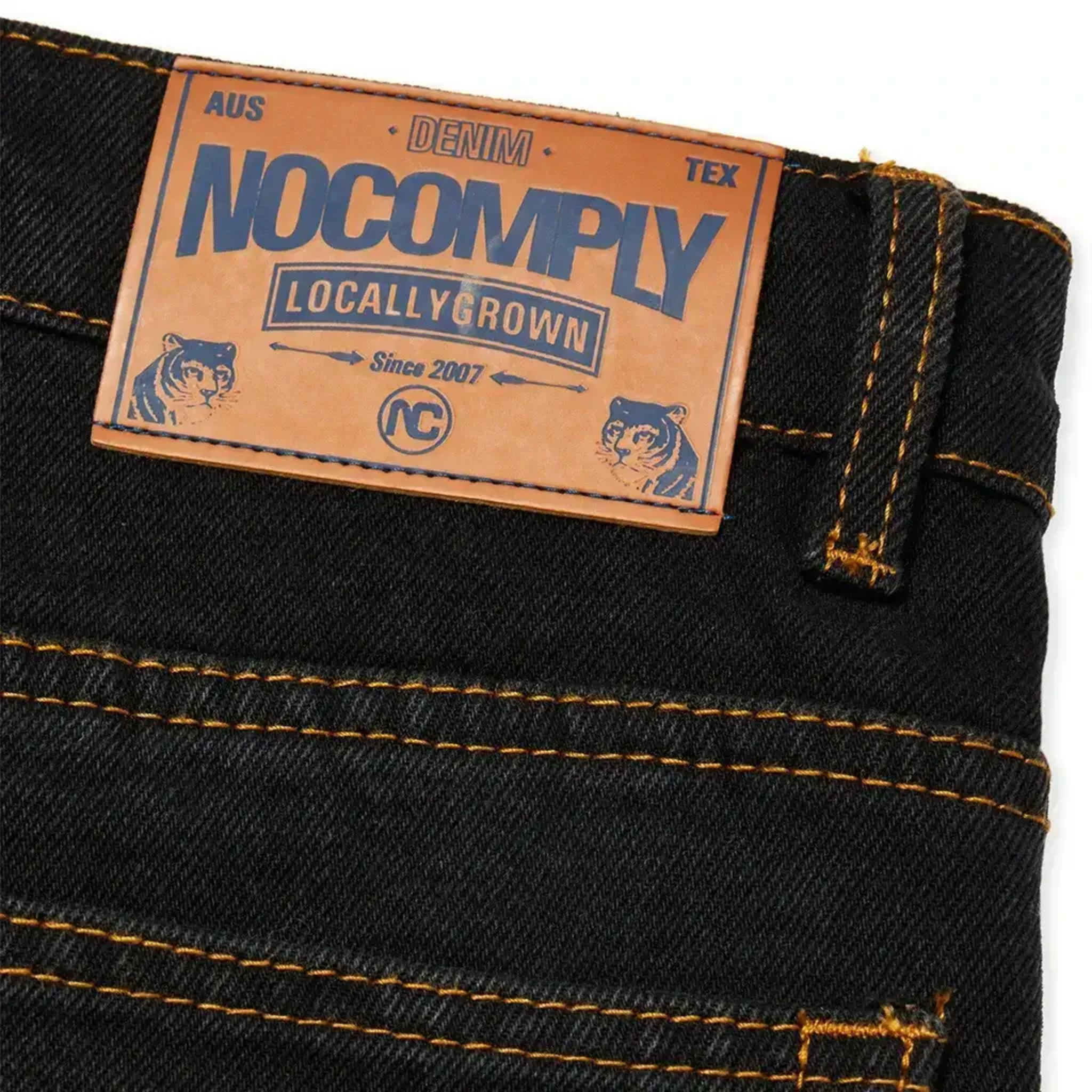 Detail Back view of Black Wash No-Comply Regular Fit denim skate jeans on a white background