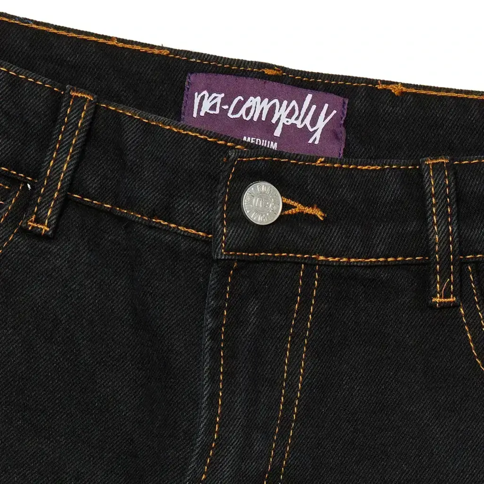 Detail front view of Black Wash No-Comply Regular Fit denim skate jeans on a white background