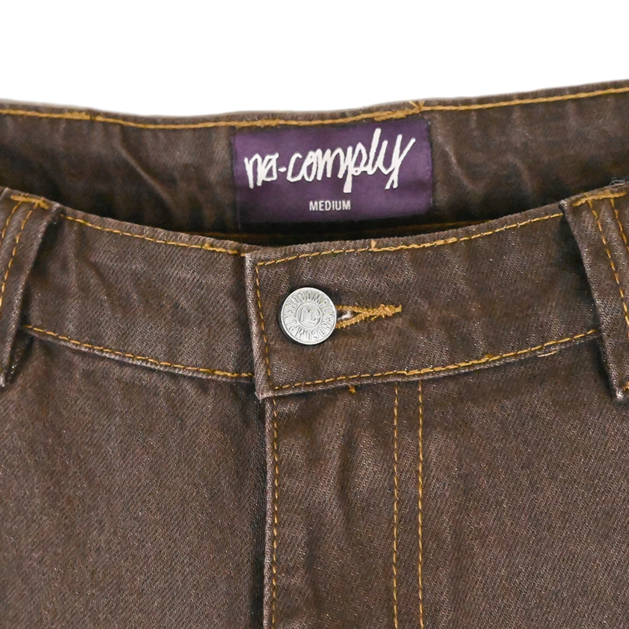 Close up front view of Brown Wash No-Comply Loose Fit denim jeans on a white background