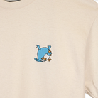 Beige sweatshirt with a blue cartoon character on the chest