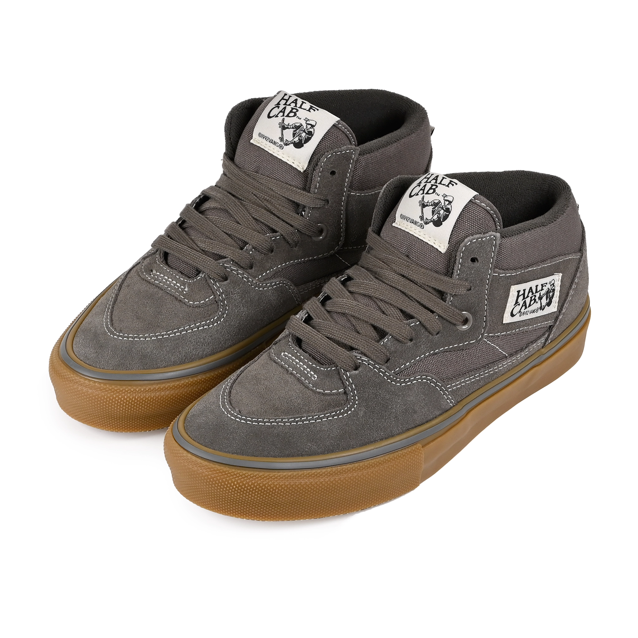 A pair of Walnut Vans Skateboarding Skate Half Cab skateboard sneakers with a gum sole on a white background