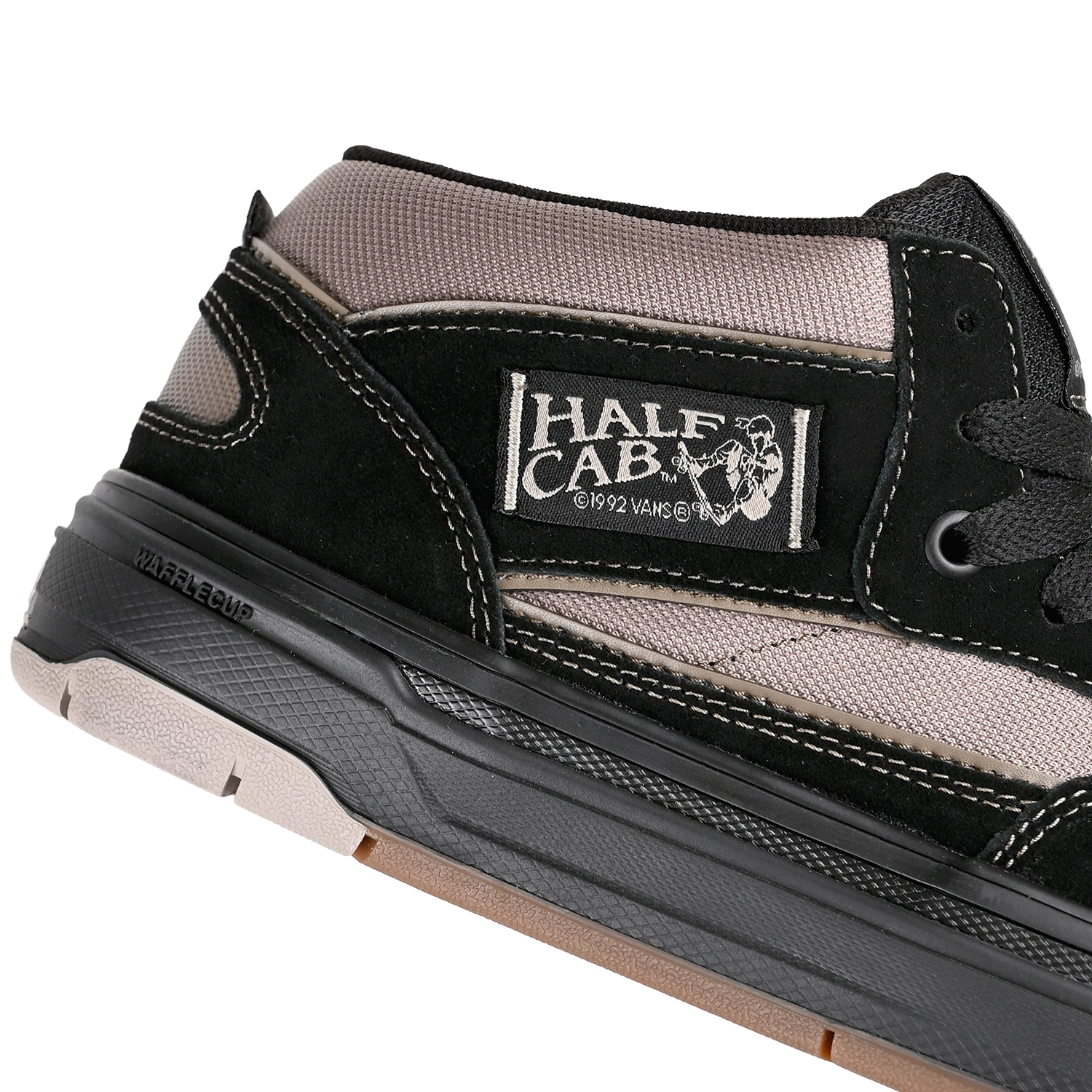 Close up of Black and peyote Vans Skateboarding Skate Half Cab Wafflecup men's skateboard sneaker on a white background