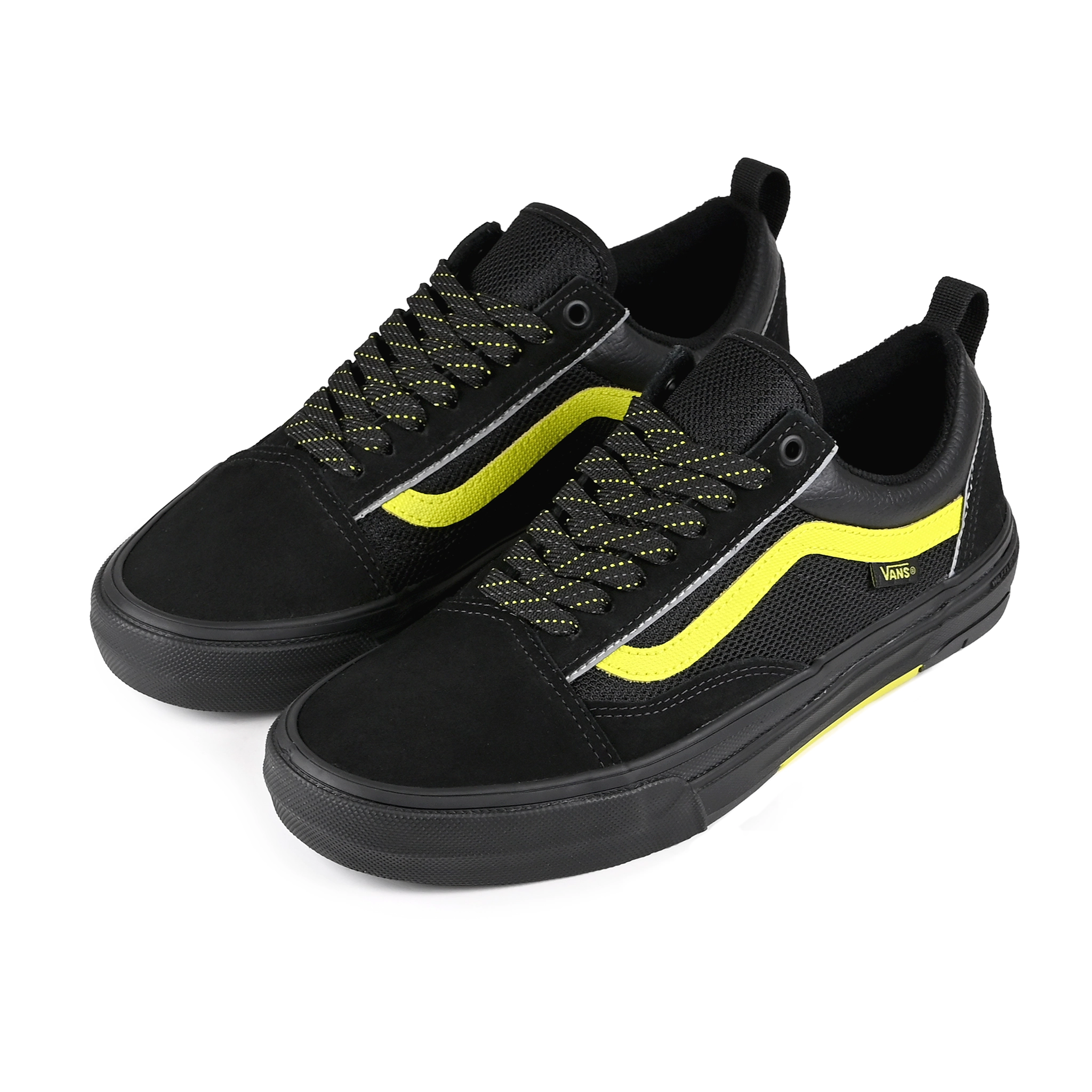 A pair of Black reflective Vans Skateboarding Skate Old Skool Wafflecup skateboard sneakers with Lime Jazz stripe on a white background.