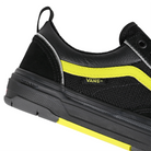 Detail of Black reflective Vans Skateboarding Skate Old Skool Wafflecup skateboard sneaker with Lime Jazz stripe on a white background.